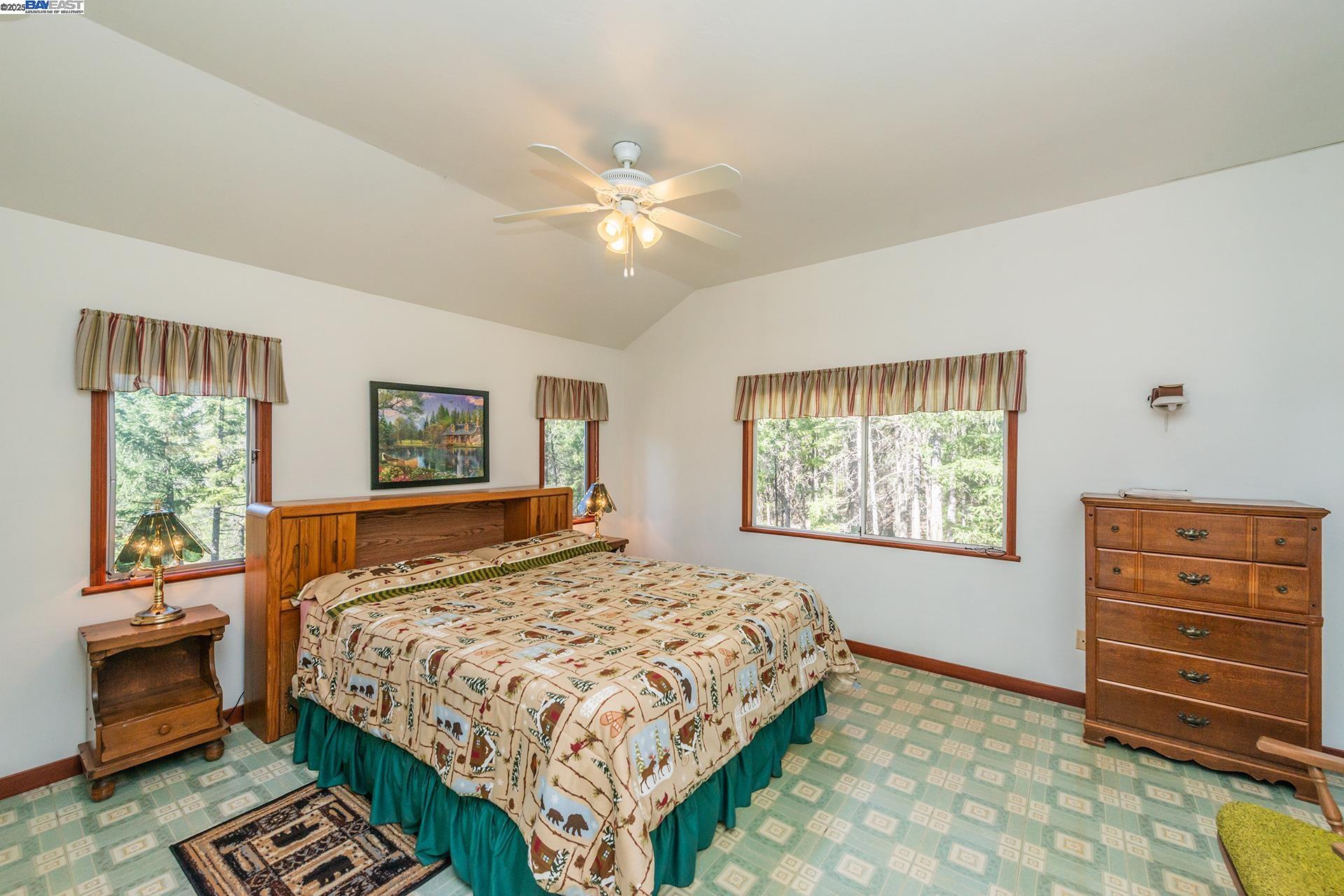 8341 East Side Road Trinity Center, CA 96091 - Photo 25 of 58 a bedroom with a bed and a dresser next to a window