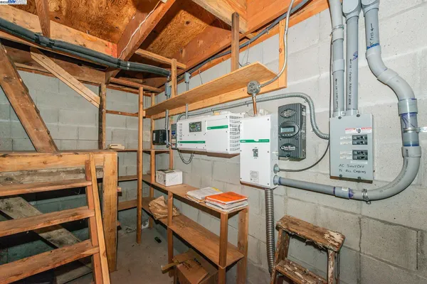 a bedroom with furniture and a book shelf