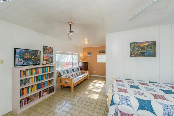 a bedroom with a large bed and a window