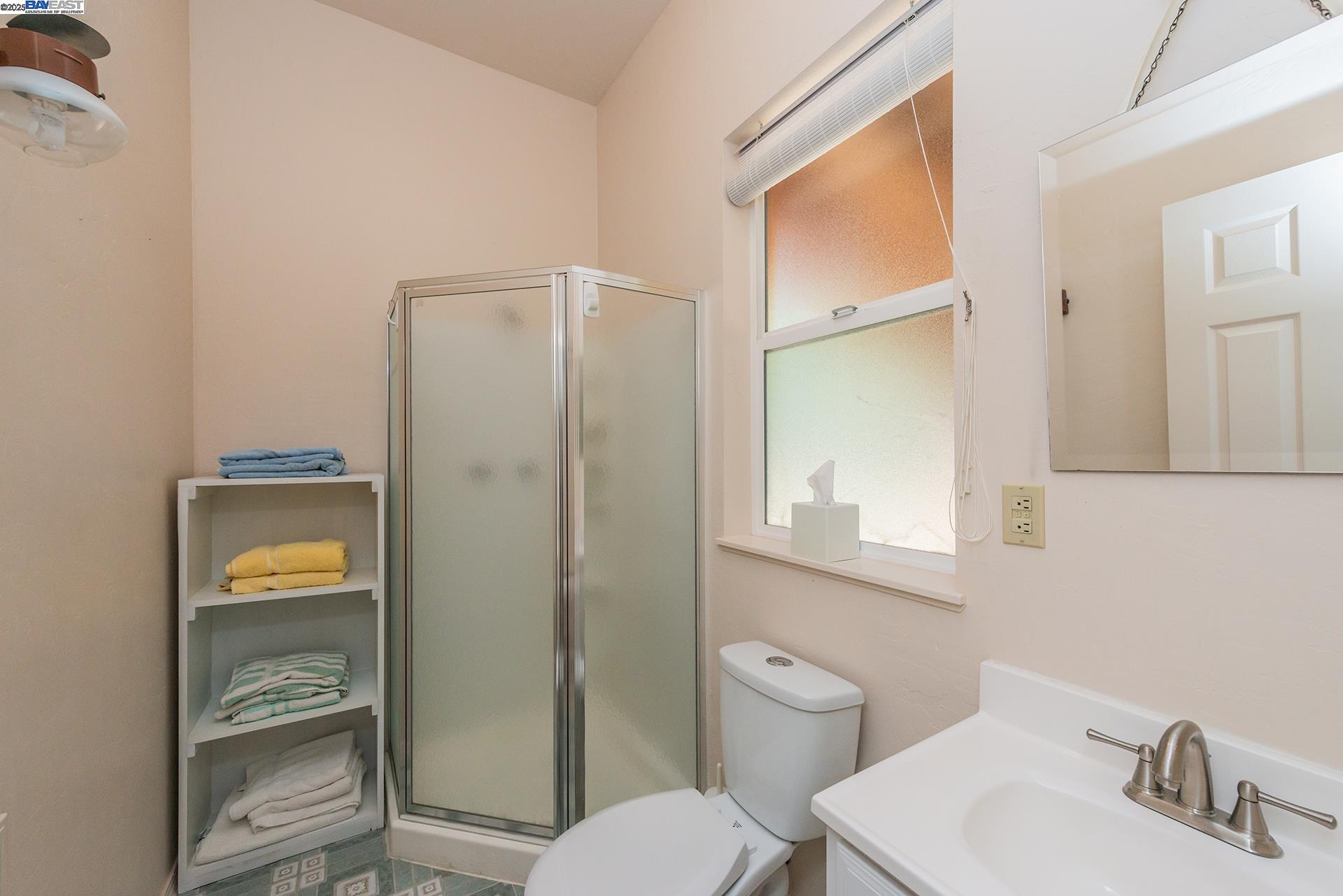 8341 East Side Road Trinity Center, CA 96091 - Photo 35 of 58 a bathroom with a toilet a sink and mirror