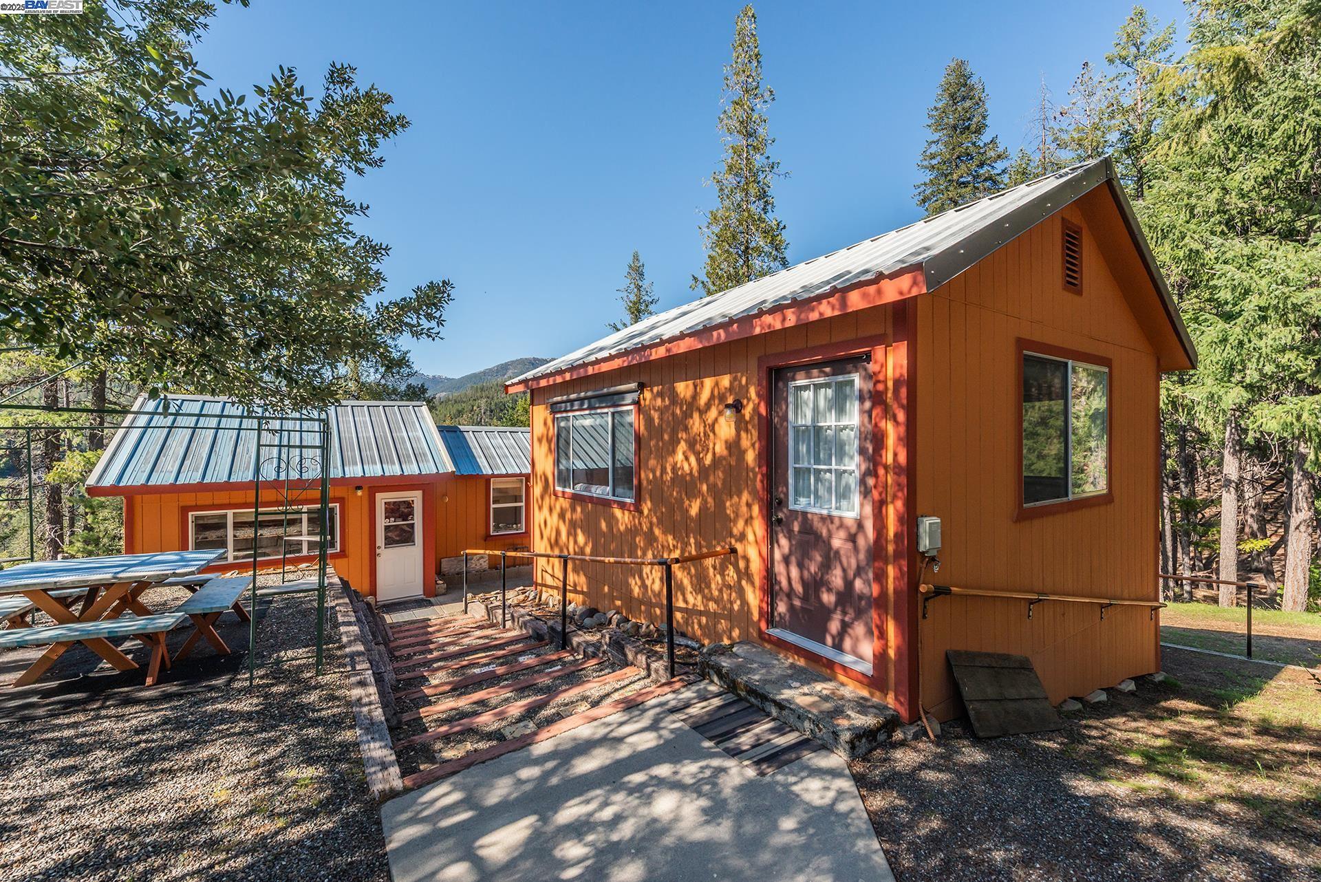 8341 East Side Road Trinity Center, CA 96091 - Photo 36 of 58 a backyard of a house with barbeque oven table and chairs