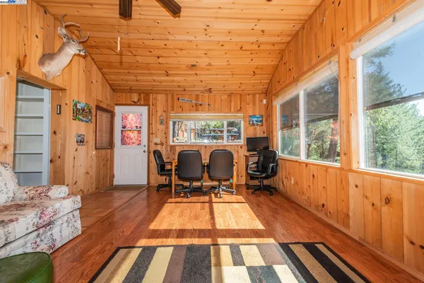 a outdoor space with wooden floor and furniture