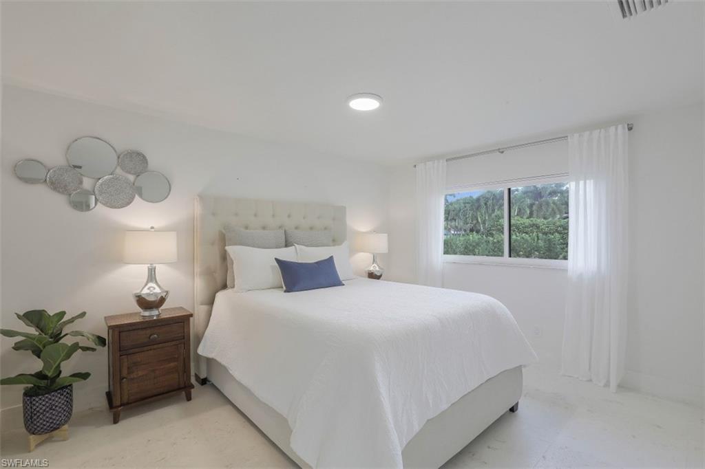 796 Ketch Drive Naples, FL 34103 - Photo 13 of 13 a bedroom with a bed and a window