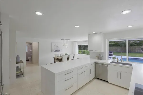 a kitchen with cabinets and stainless steel appliances