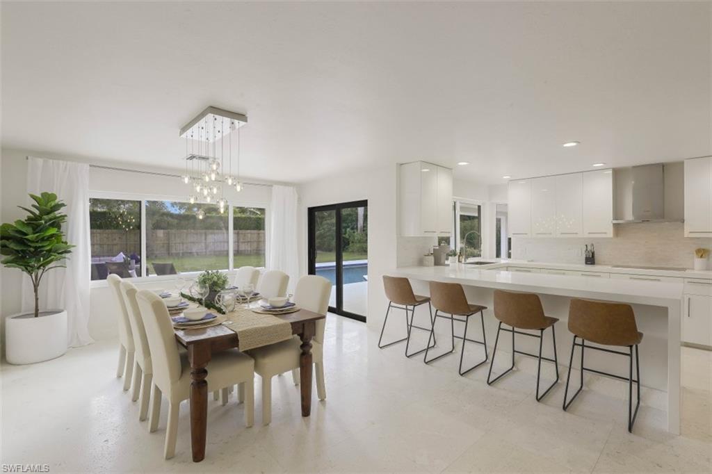 796 Ketch Drive Naples, FL 34103 - Photo 9 of 13 a view of a dining room with furniture window and outside view