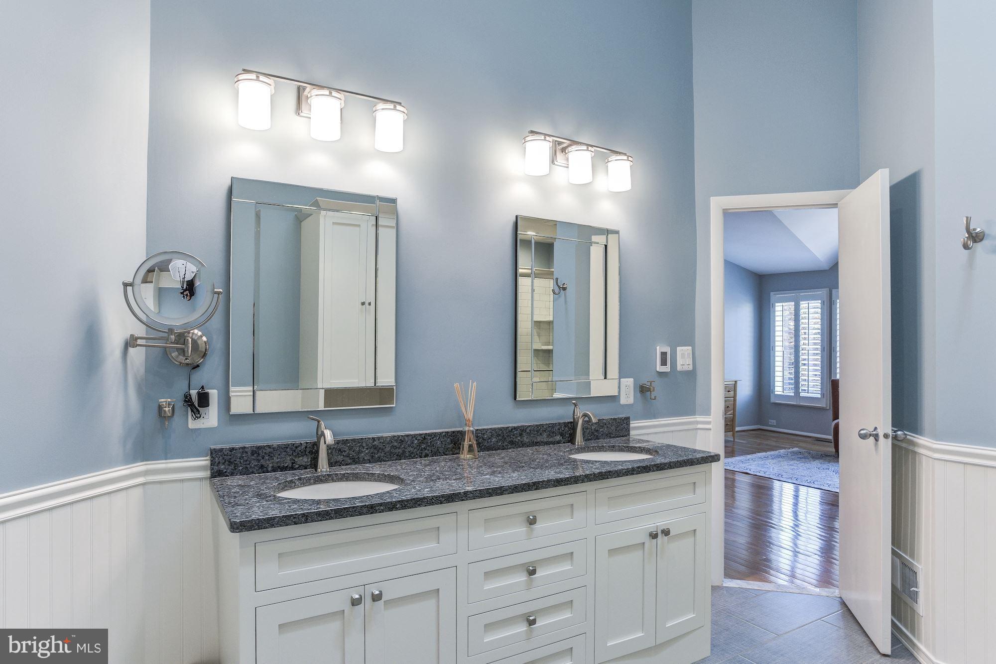 1965 Lakeport Way Reston, VA 20191 - Photo 14 of 28 a bathroom with double sink and a mirror