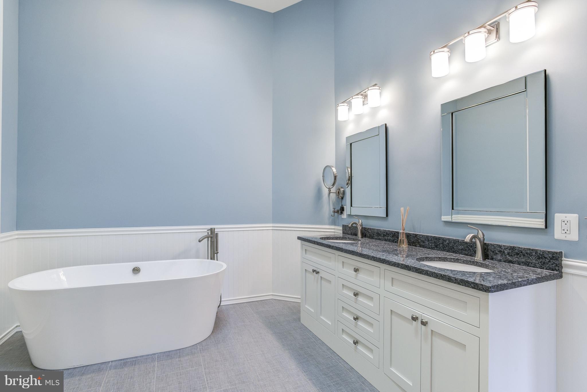 1965 Lakeport Way Reston, VA 20191 - Photo 15 of 28 a bathroom with a bathtub and a sink