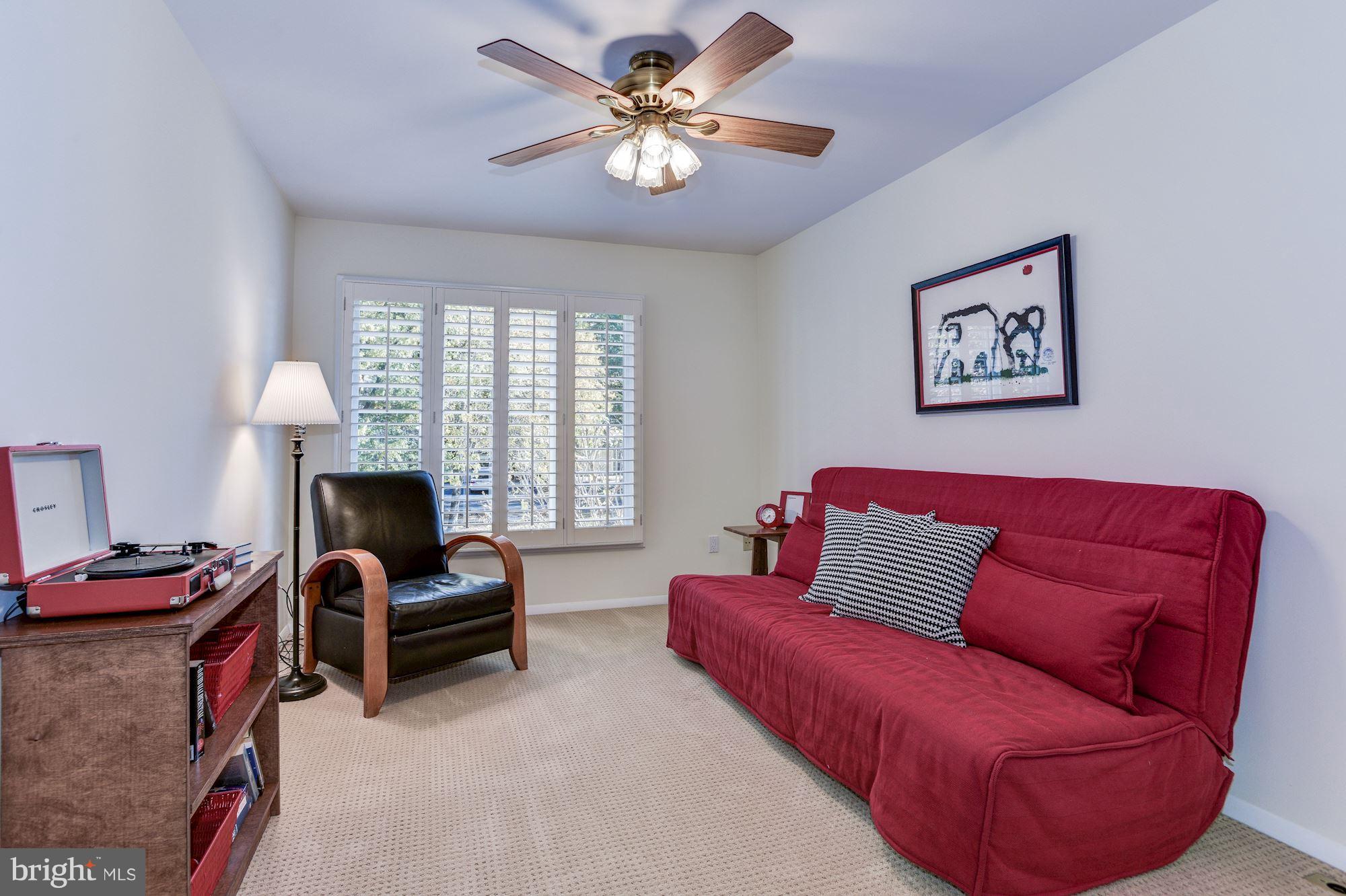 1965 Lakeport Way Reston, VA 20191 - Photo 16 of 28 a living room with furniture ceiling fan and a window