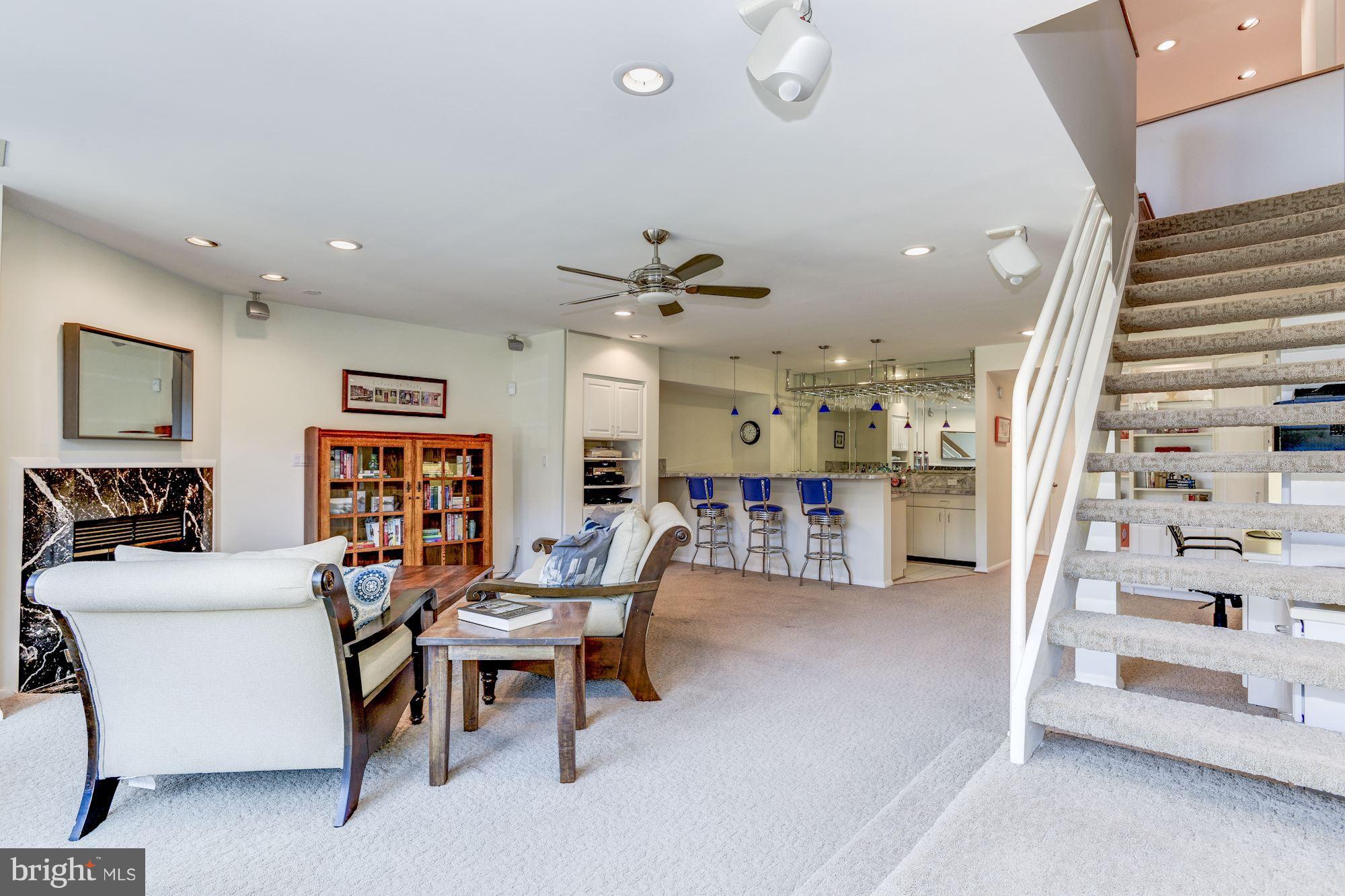 1965 Lakeport Way Reston, VA 20191 - Photo 18 of 28 a living room with furniture and a book shelf