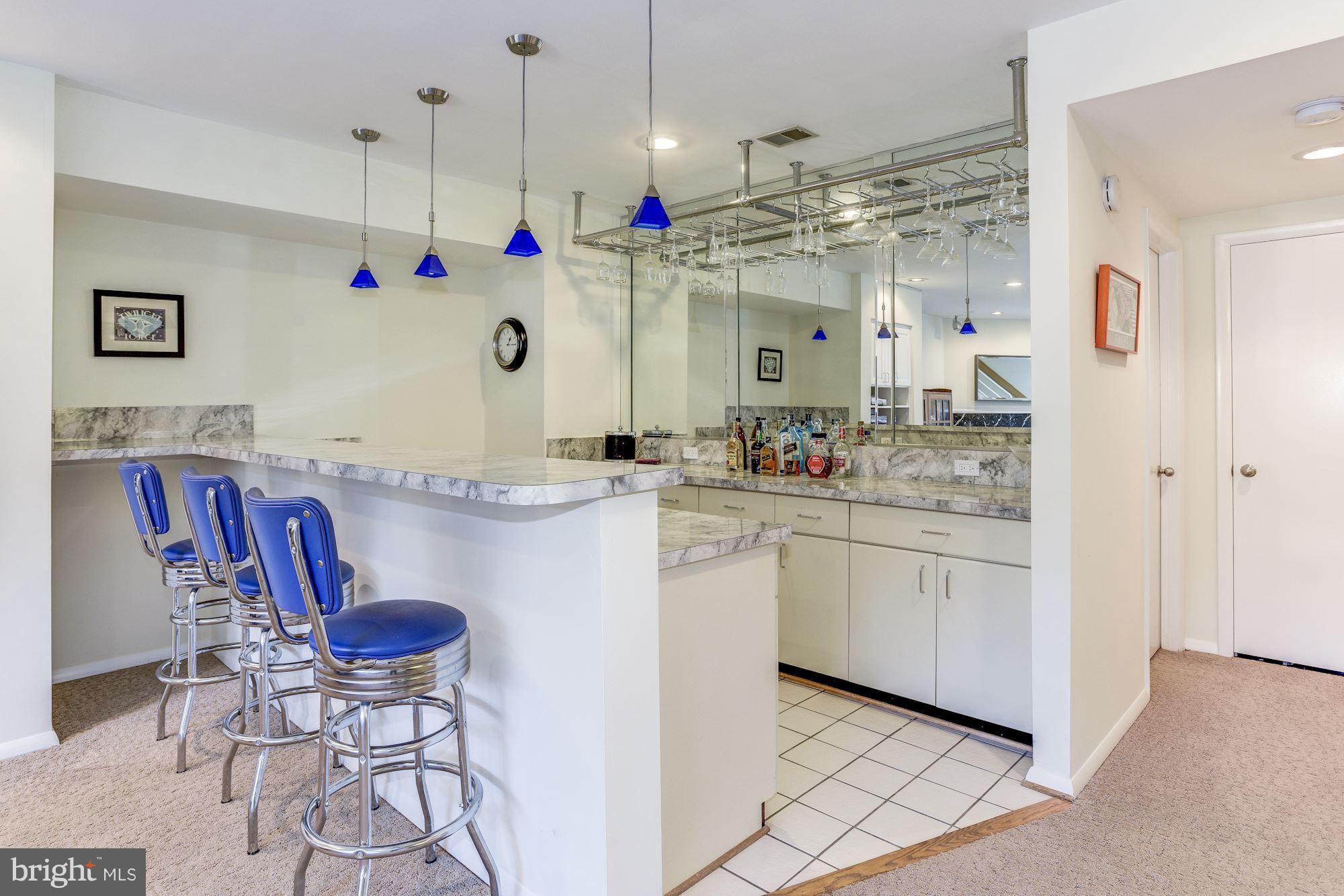 1965 Lakeport Way Reston, VA 20191 - Photo 21 of 28 a kitchen with stainless steel appliances granite countertop a sink and a refrigerator