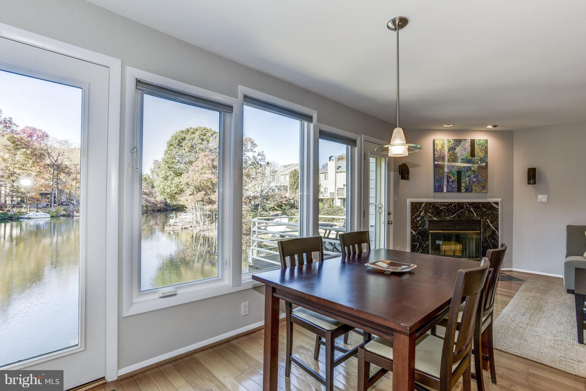 1965 Lakeport Way Reston, VA 20191 - Photo 6 of 28 a view of a dining room with furniture window and wooden floor