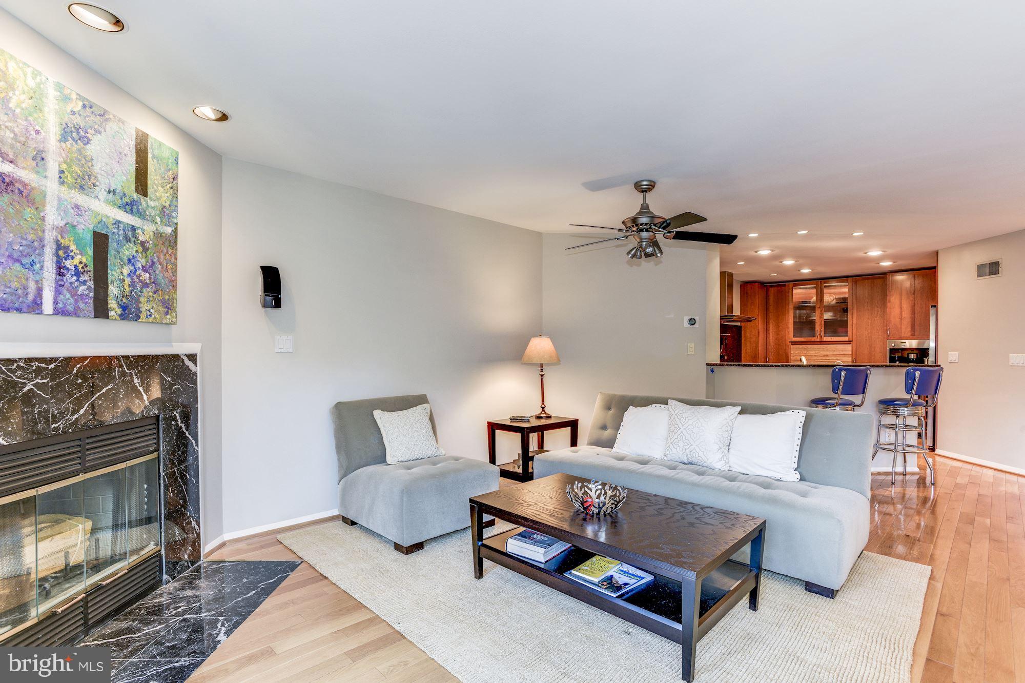 1965 Lakeport Way Reston, VA 20191 - Photo 8 of 28 a living room with furniture and a fireplace