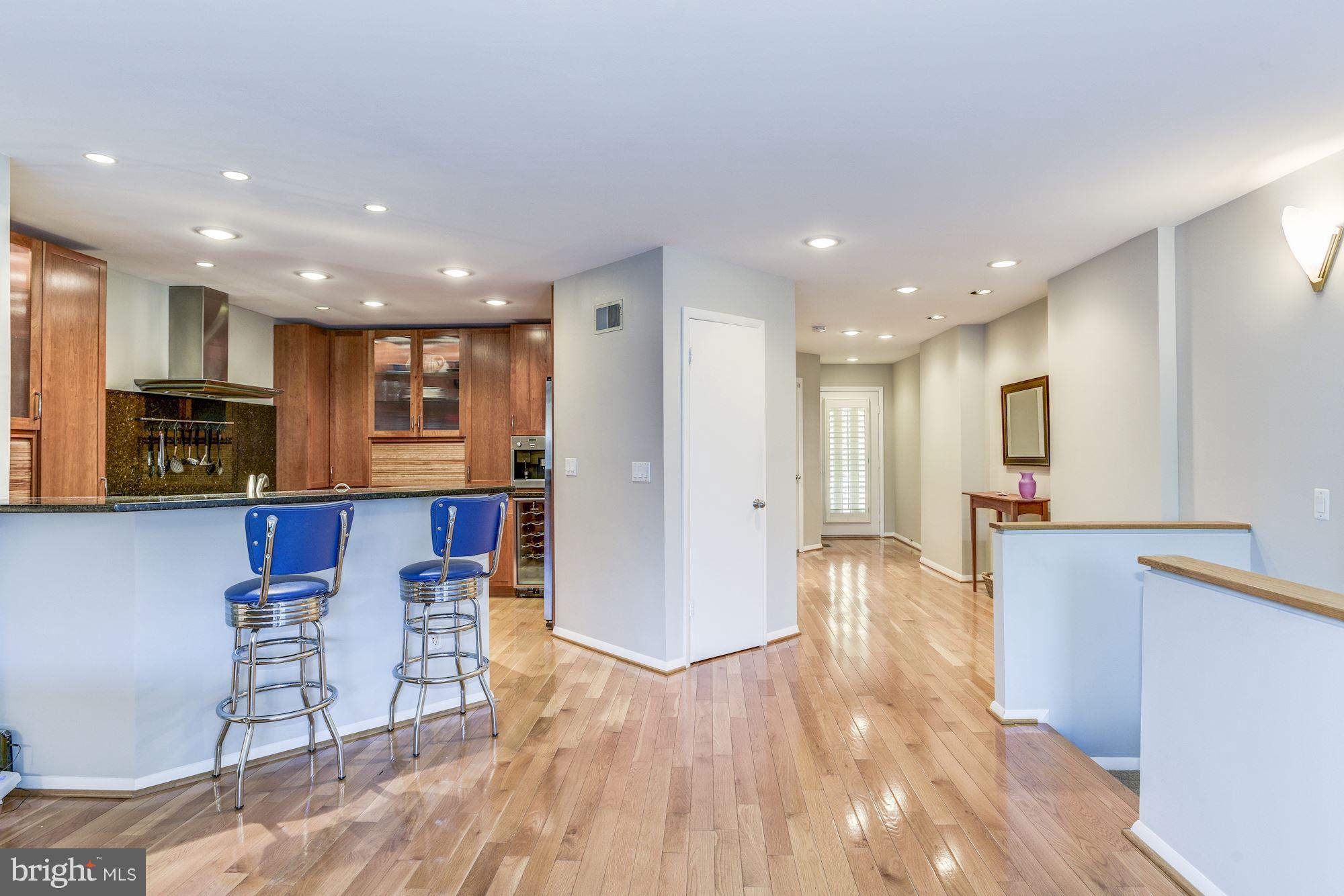 1965 Lakeport Way Reston, VA 20191 - Photo 9 of 28 a view of kitchen with stainless steel appliances refrigerator stove and chair
