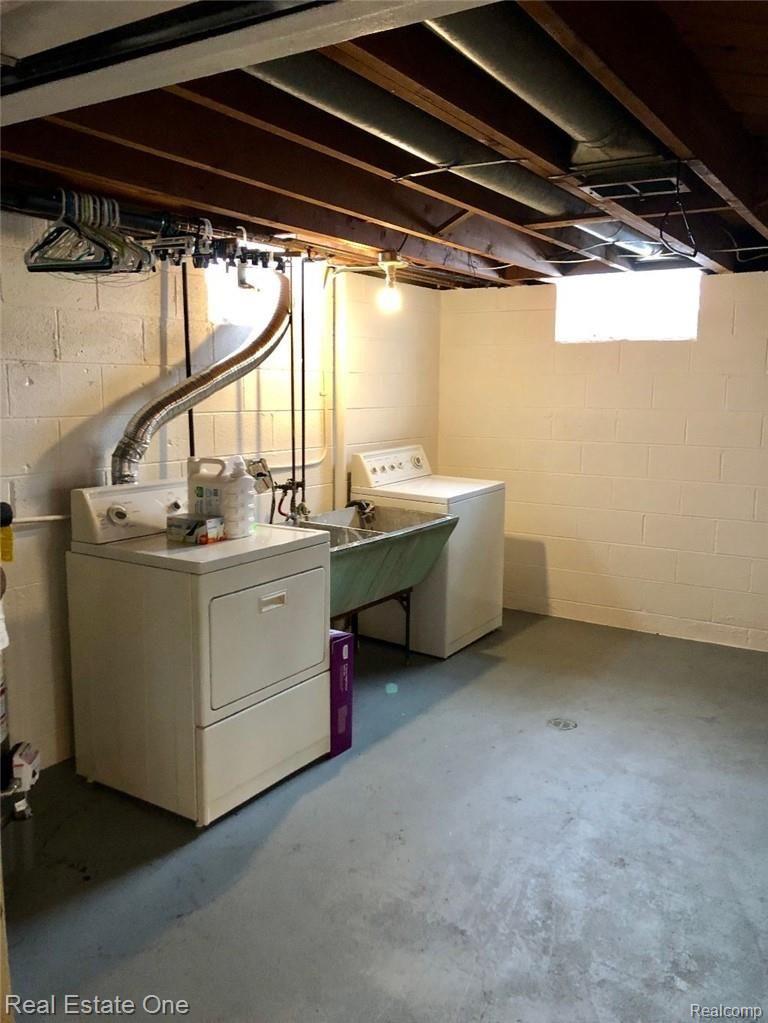 18828 Inkster Road Redford, MI 48240 - Photo 14 of 18 LAUNDRY AREA IN BASEMENT IS CLEAN AND DRY AND WASHER & DRYER ARE INCLUDED*