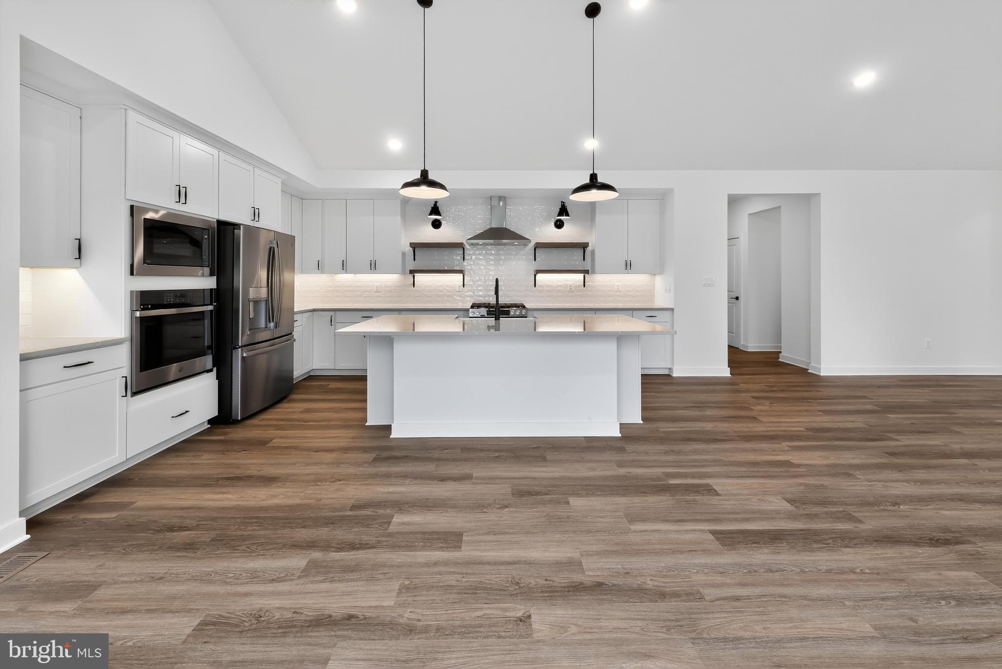 264 North Rdg Brk Drive Felton, DE 19943 - Photo 2 of 20 a view of kitchen with stainless steel appliances granite countertop a stove and a kitchen island