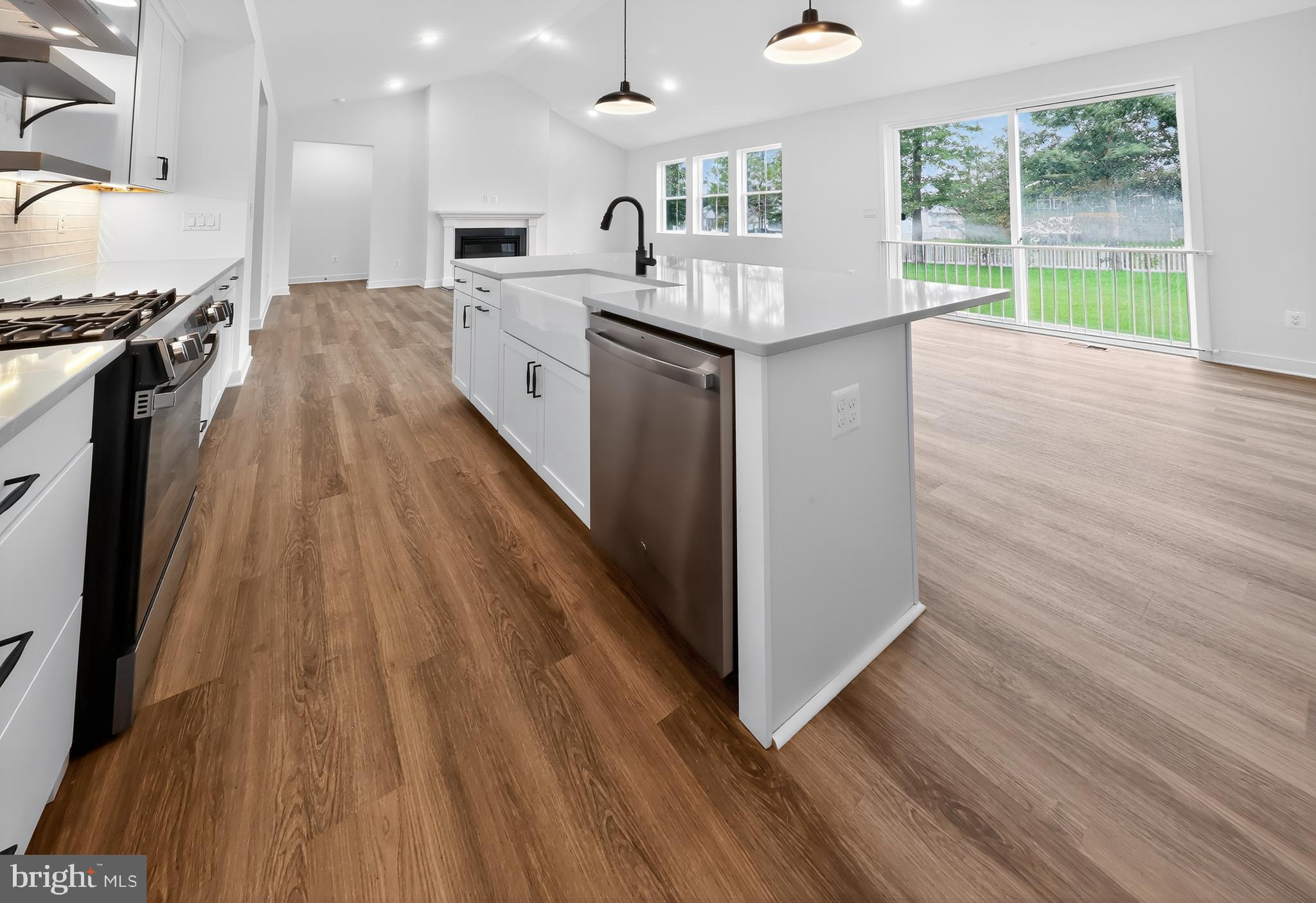 264 North Rdg Brk Drive Felton, DE 19943 - Photo 7 of 20 a kitchen with kitchen island wooden floors and stainless steel appliances