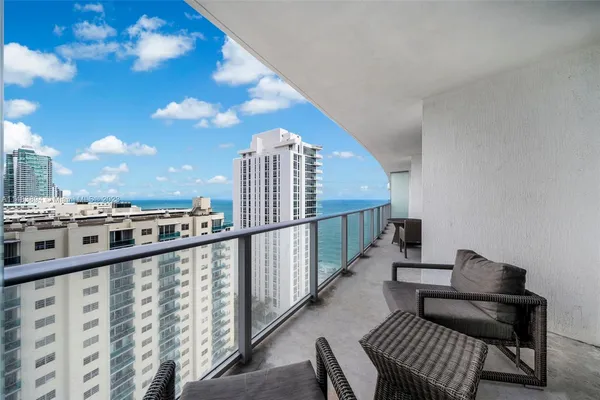 a view of balcony with furniture