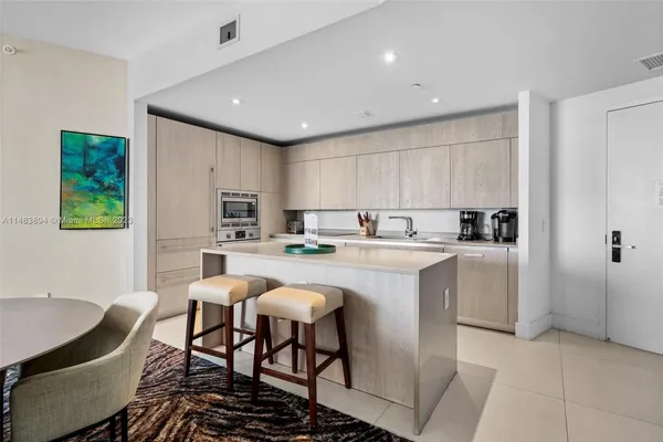 a kitchen with a sink cabinets and window
