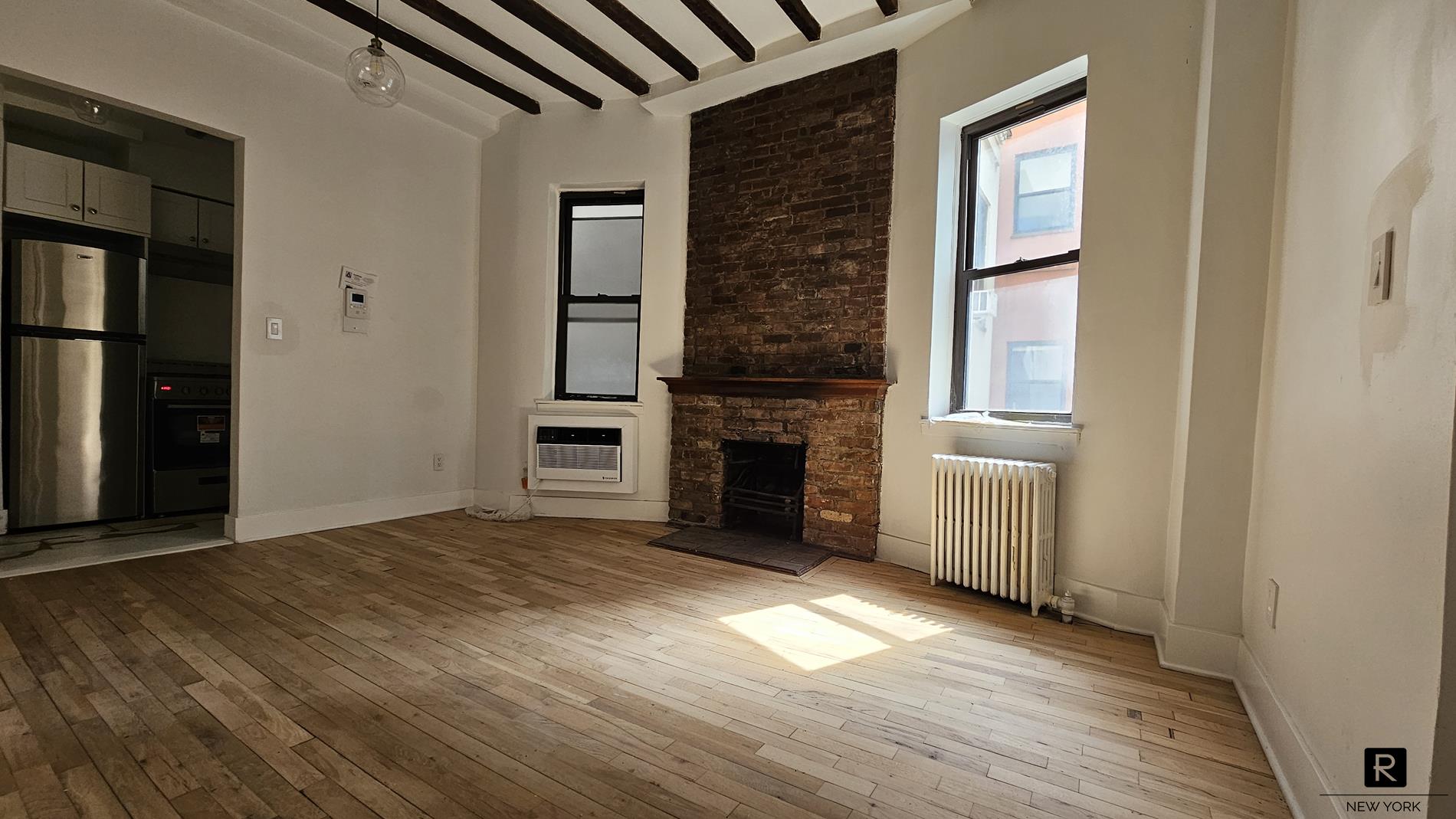 46 West 65th Street, Unit 3D Manhattan, NY 10023 - Photo 2 of 6 a view of a livingroom with a fireplace