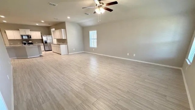 a kitchen with stainless steel appliances granite countertop a stove and a sink