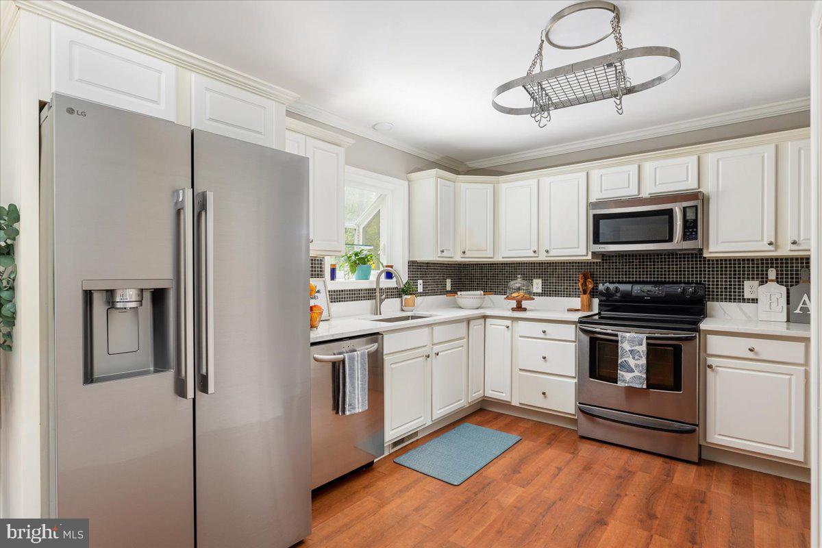 2304 High Top Road Linden, VA 22642 - Photo 9 of 42 a kitchen with cabinets stainless steel appliances and a window