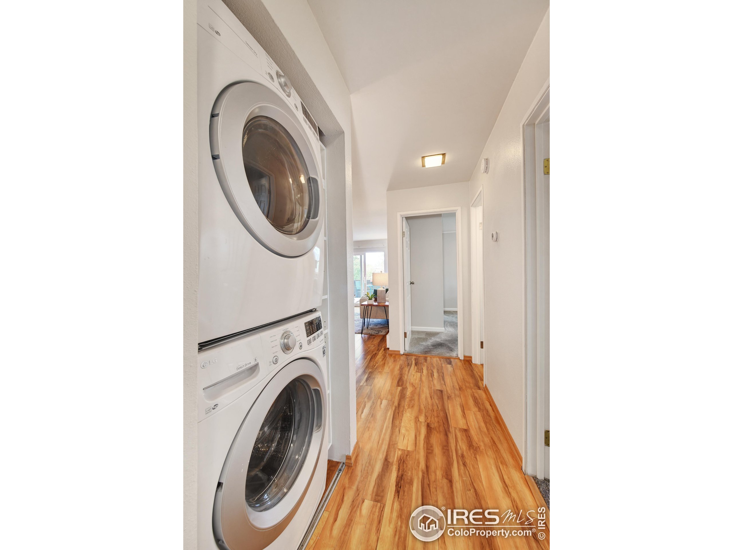 3240 Iris Avenue, Unit 201 Boulder, CO 80301 - Photo 17 of 27 a view of a hallway with washer and dryer
