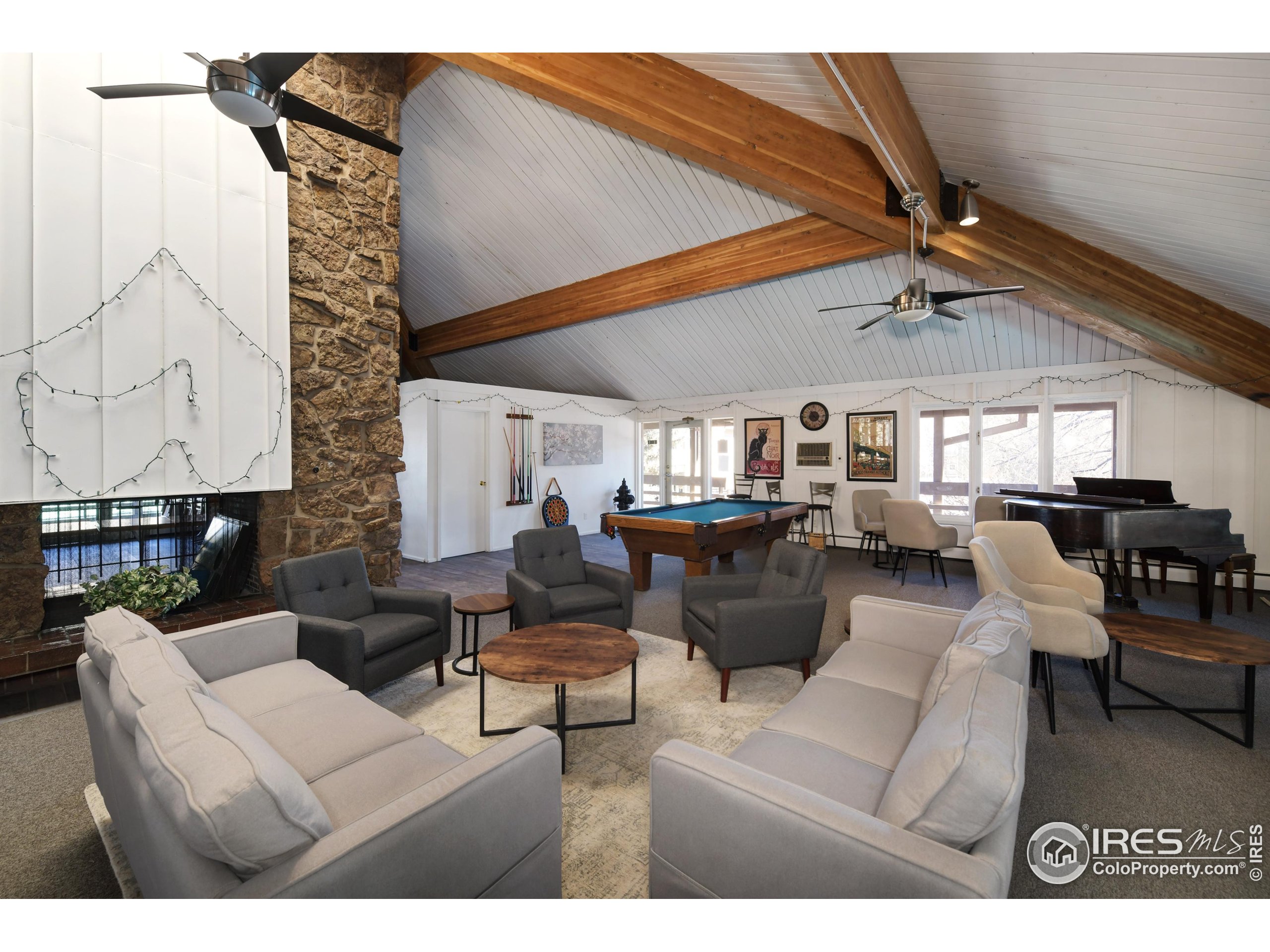3240 Iris Avenue, Unit 201 Boulder, CO 80301 - Photo 24 of 27 a living room with furniture and a large window