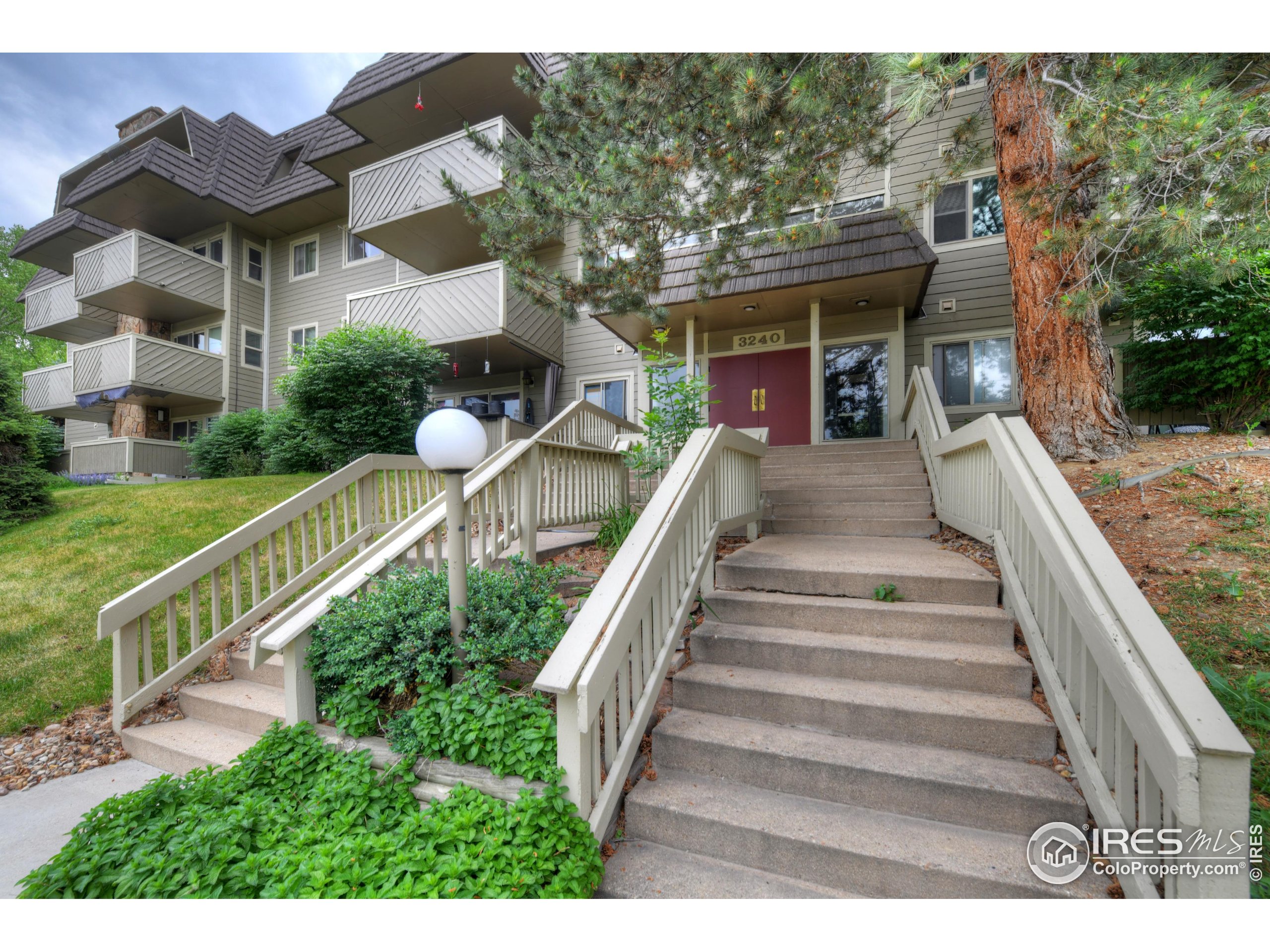 3240 Iris Avenue, Unit 201 Boulder, CO 80301 - Photo 26 of 27 a view of a house with a yard and stairs