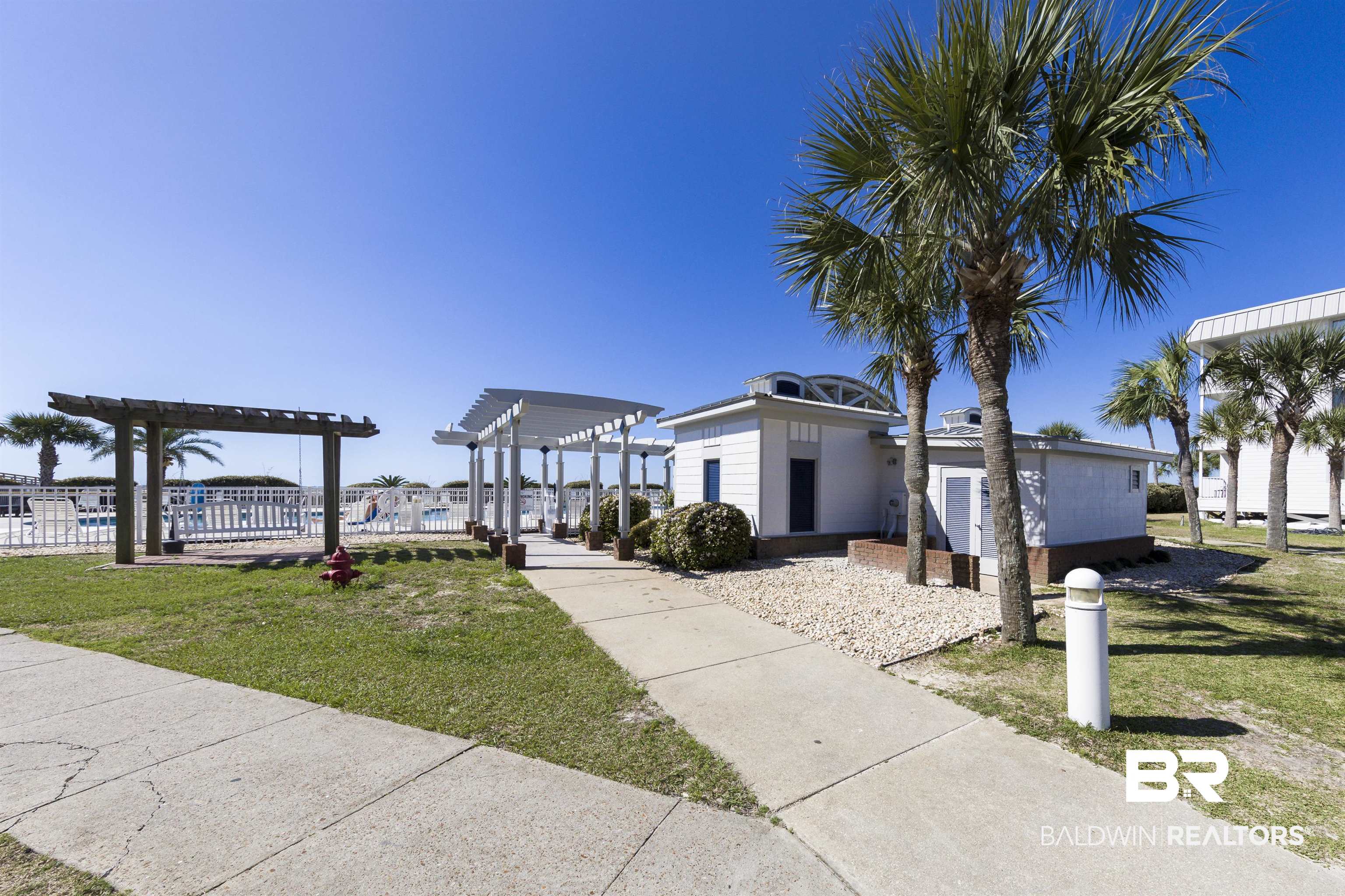 400 Plantation Road, Unit 2123 Gulf Shores, AL 36542 - Photo 31 of 44 View of front of house with a pergola and a front lawn