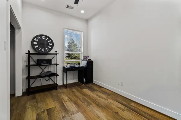 a view of workspace with wooden floor