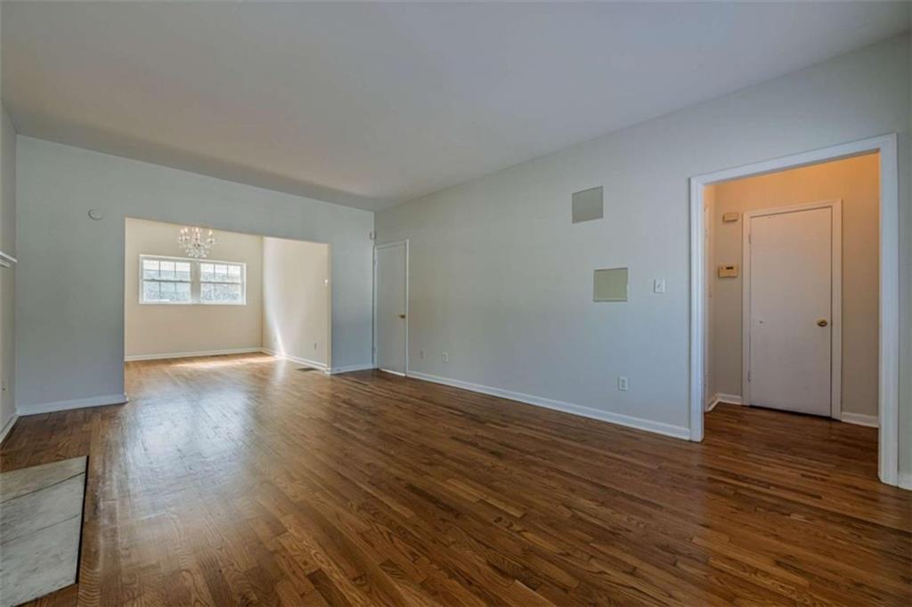 1977 North Decatur Road Atlanta, GA 30307 - Photo 11 of 59 an empty room with wooden floor and windows