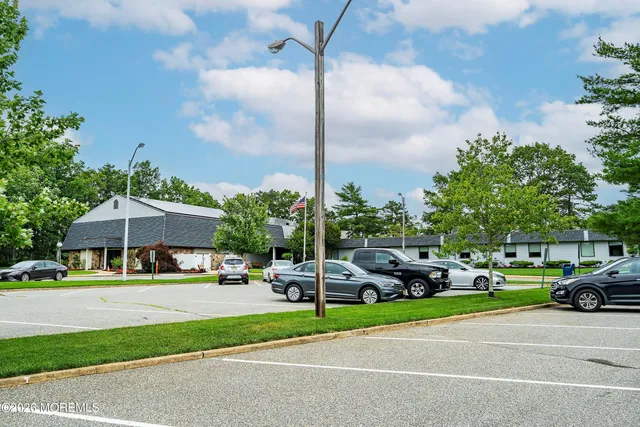 a aerial view of a house with swimming pool table and chairs