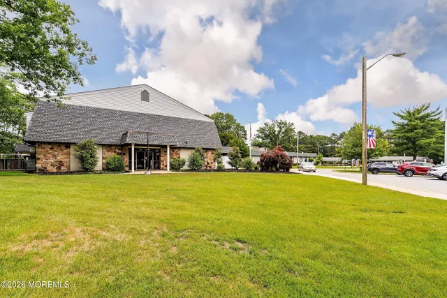 a view of a patio with table and chairs and potted plants