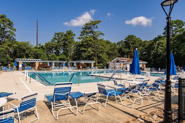a view of a swimming pool with a patio