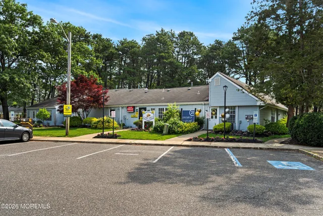 a view of a table and chairs under an umbrella