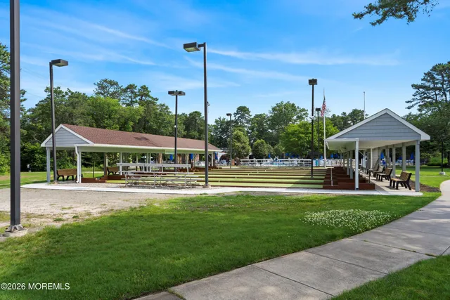 a view of a park with large trees