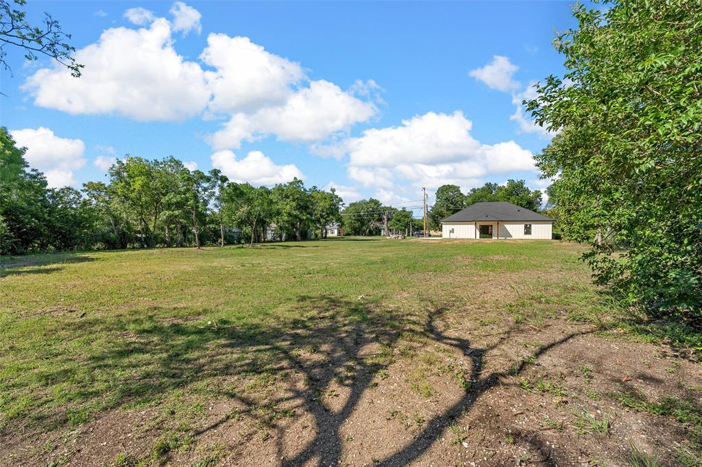 3320 North 27th Street Waco, TX 76708 - Photo 33 of 38 a view of a green field with wooden fence