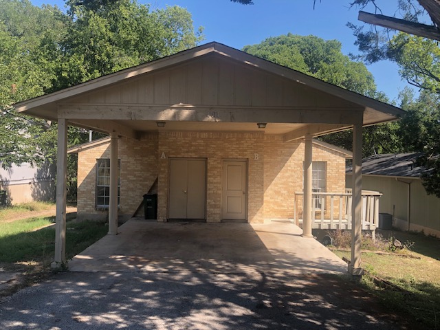 404 West Dittmar Road Austin, TX 78745 - Photo 1 of 15 View of front facade with brick siding, driveway, and board and batten siding