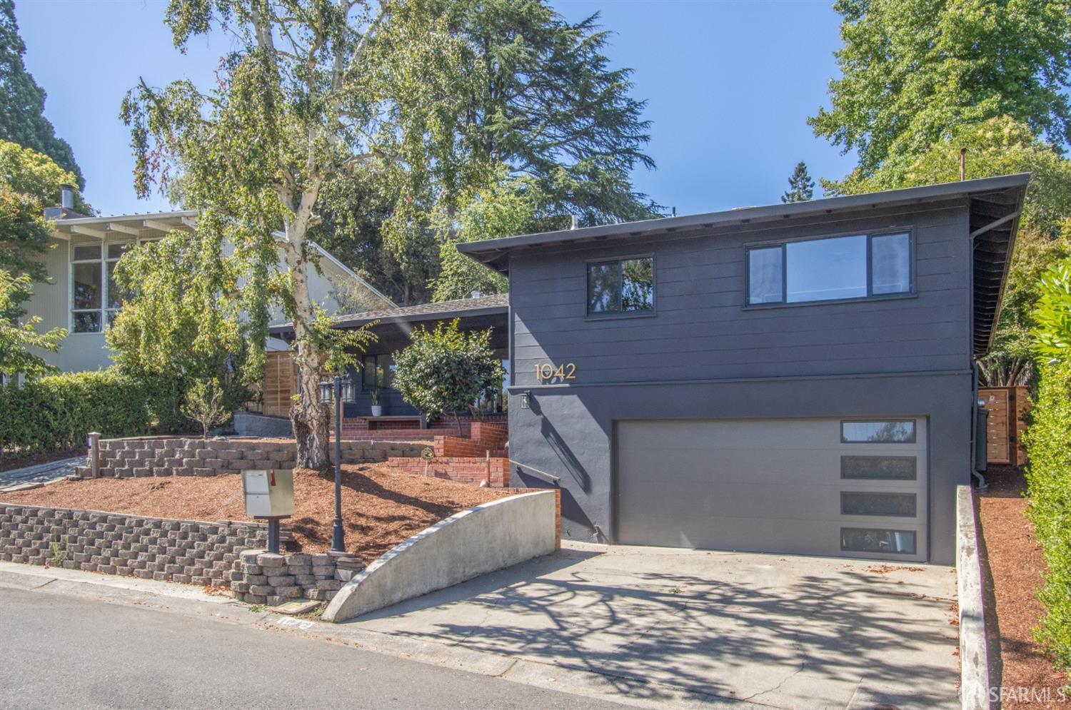 1042 Middlefield Road Berkeley, CA 94708 - Photo 1 of 1 a front view of a house with a yard