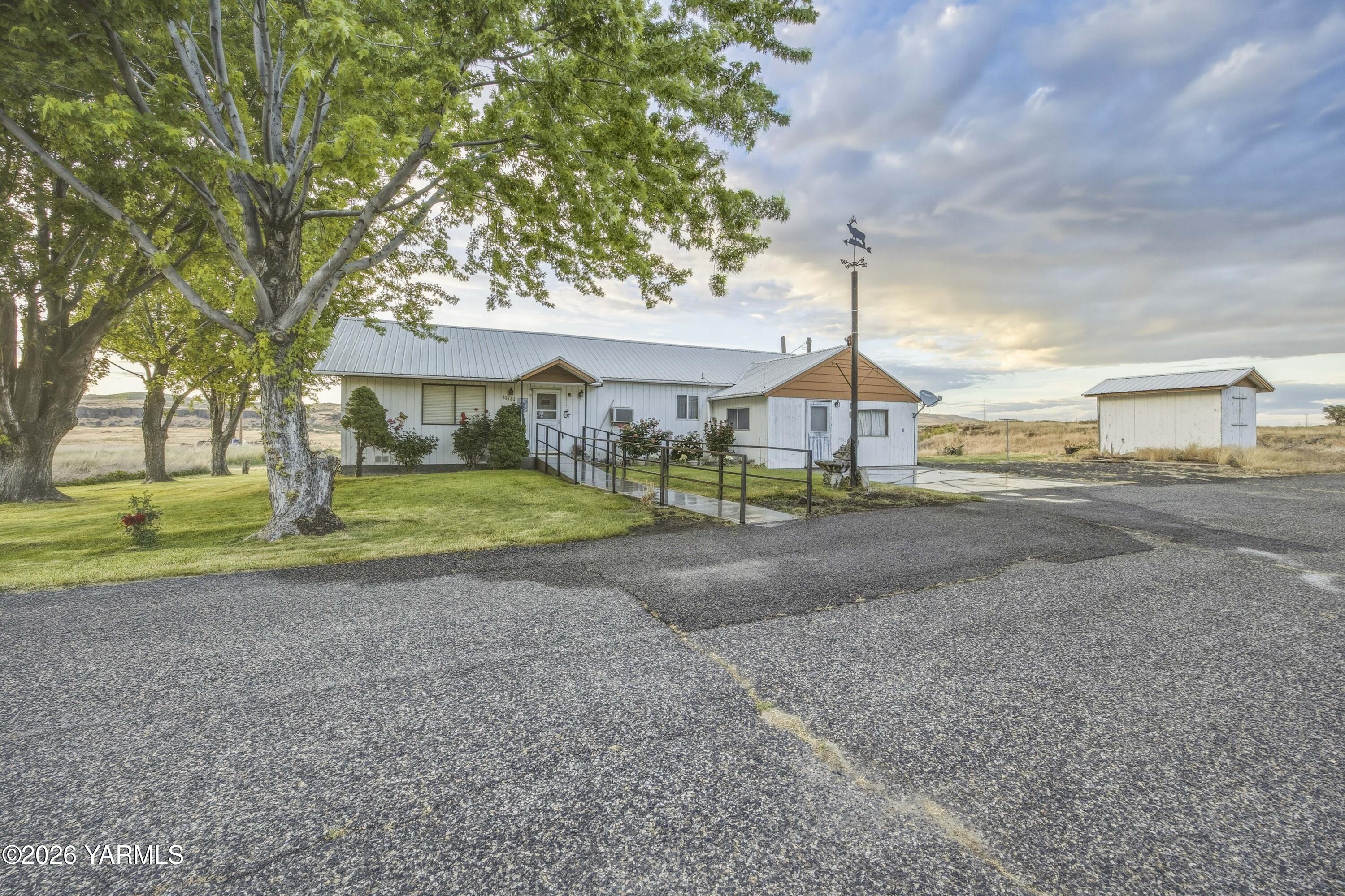 36322 D Mccall Road North Benton City, WA 99320 - Photo 18 of 39 a view of a house with a yard