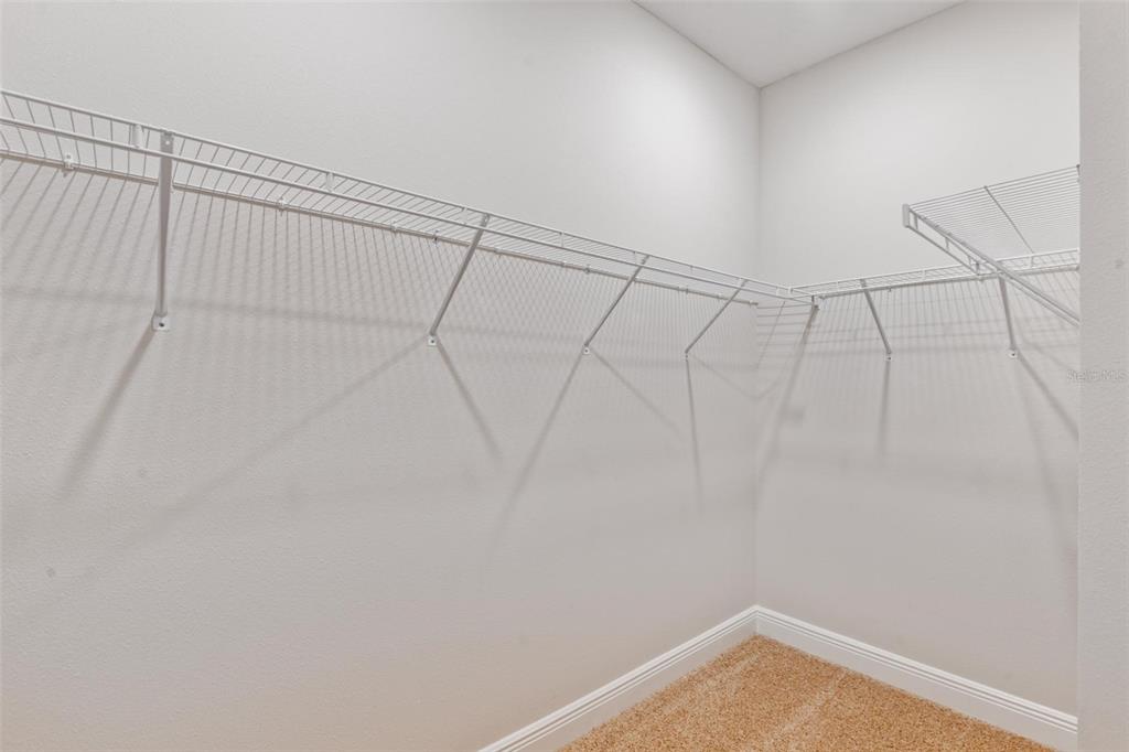 9753 Southwest 62nd Court Ocala, FL 34476 - Photo 17 of 31 a view of a room with racks on the wall