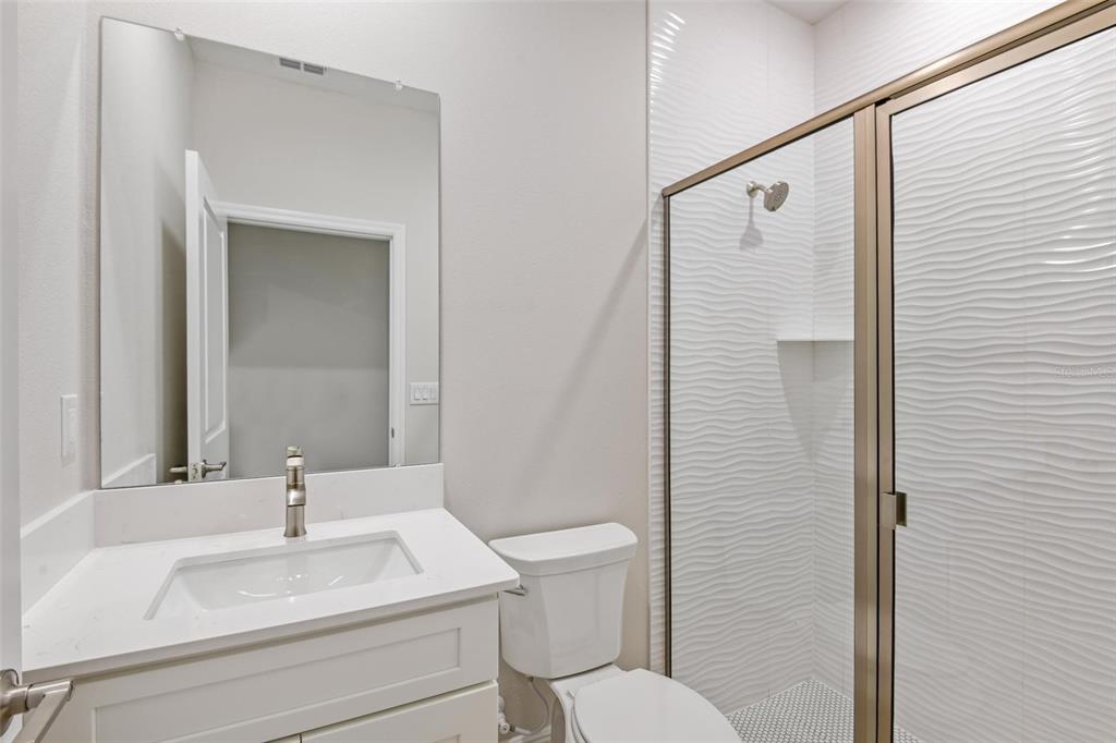9753 Southwest 62nd Court Ocala, FL 34476 - Photo 20 of 31 a bathroom with a sink toilet and shower