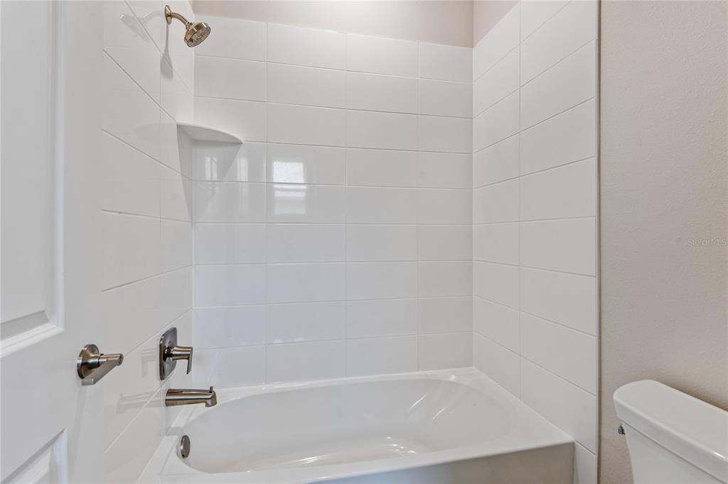 9753 Southwest 62nd Court Ocala, FL 34476 - Photo 21 of 31 a bathroom with a tub