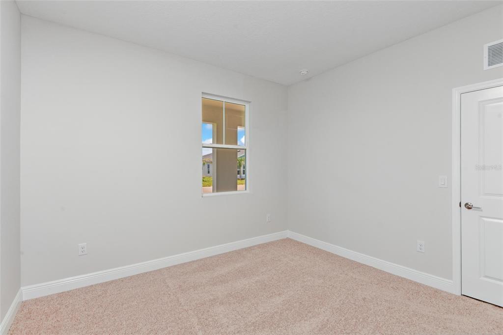 9753 Southwest 62nd Court Ocala, FL 34476 - Photo 23 of 31 an empty room with a window