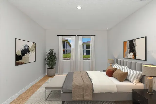 a bedroom with a bed and glass windows