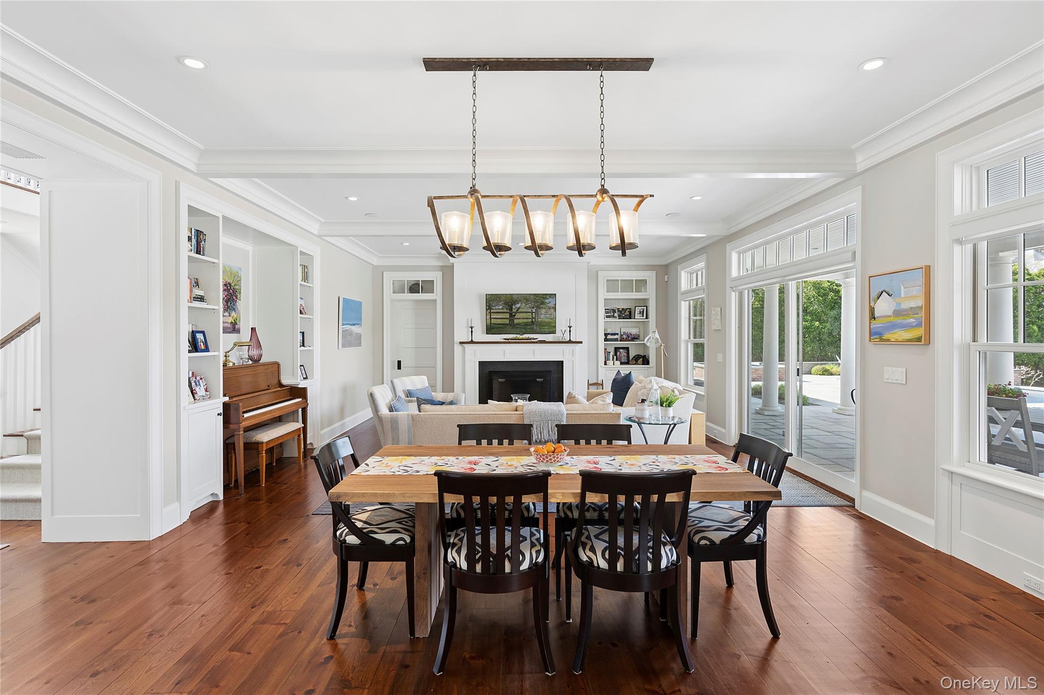 43 Old Main Road Quogue, NY 11959 - Photo 8 of 28 a view of a dining room with furniture window and wooden floor