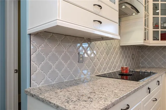 a kitchen with a sink and cabinets