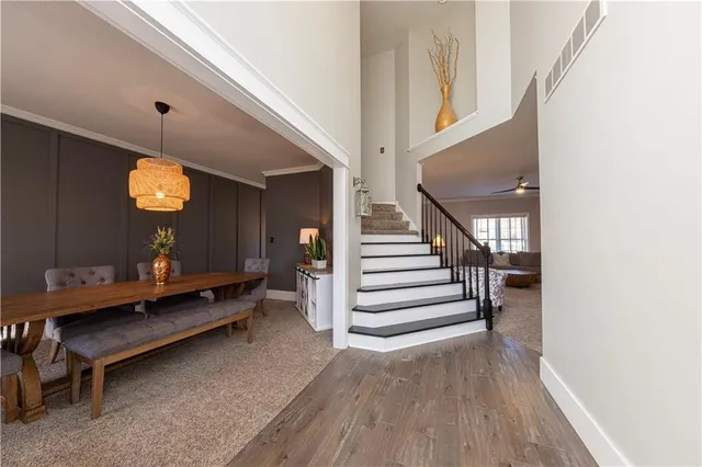a view of entryway and hall with wooden floor