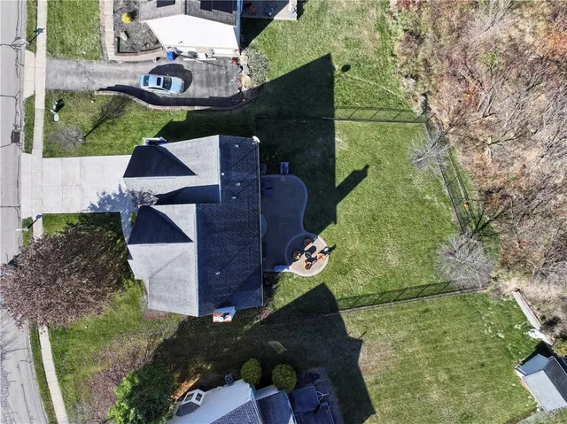 an aerial view of houses with yard