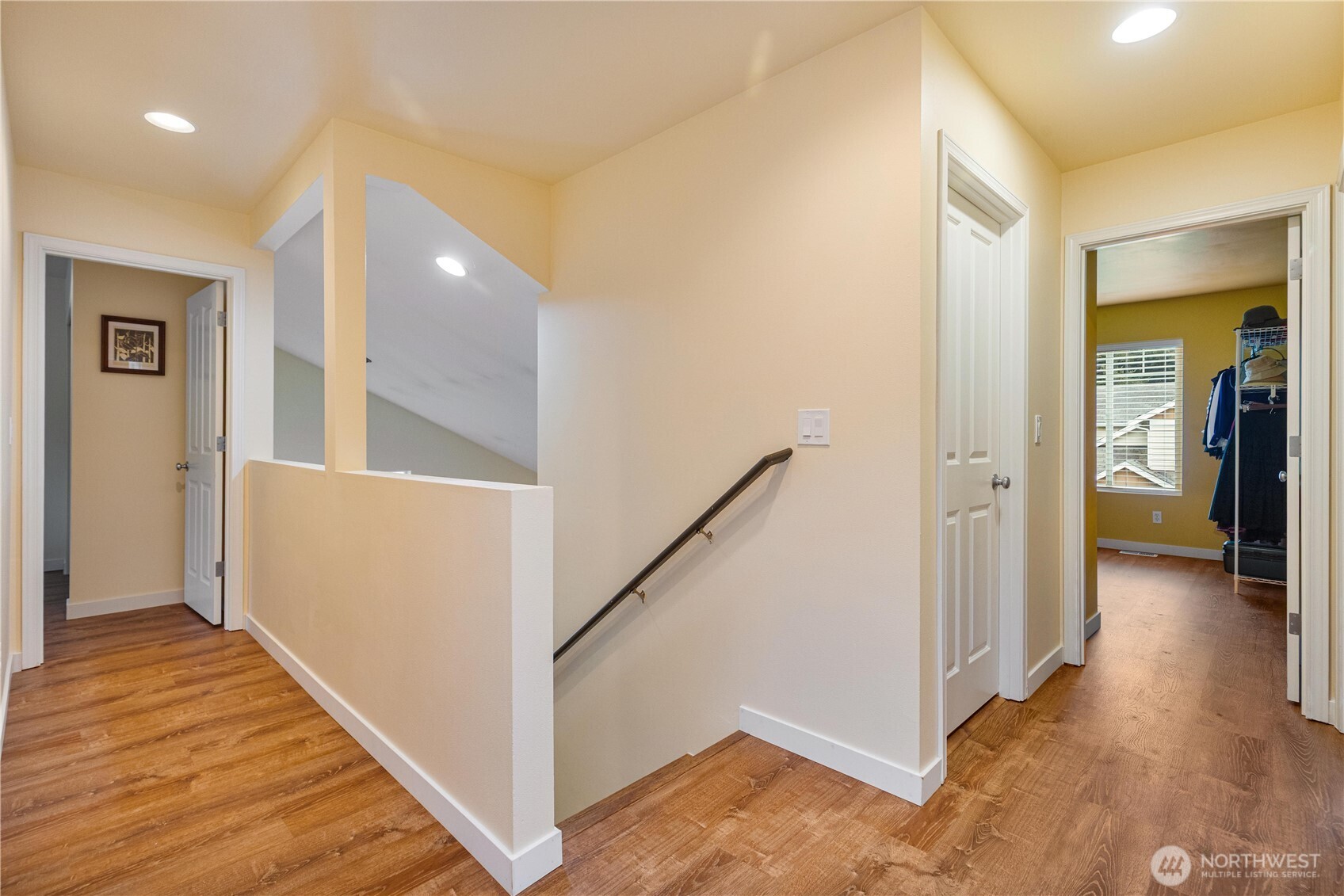 28104 Maple Ridge Way Southeast Maple Valley, WA 98038 - Photo 14 of 26 a view of a hallway view with wooden floor and staircase